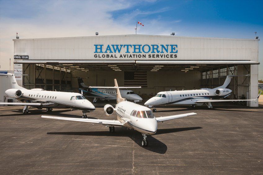 Planes parked outside of Hawthorne hanger